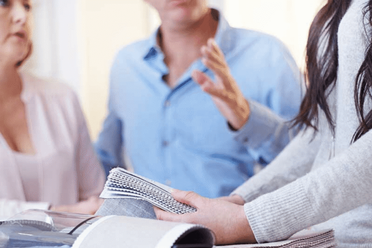 People reviewing fabric and flooring samples