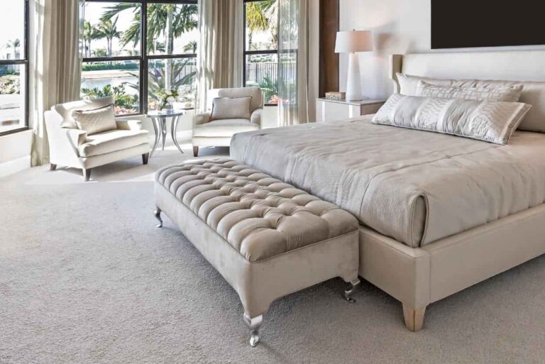 Bedroom featuring soft cut pile carpet flooring.