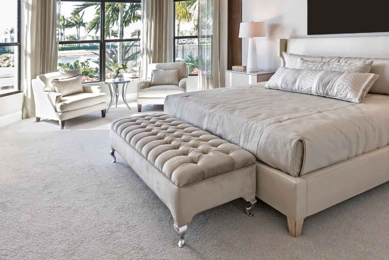 Bedroom featuring soft cut pile carpet flooring.