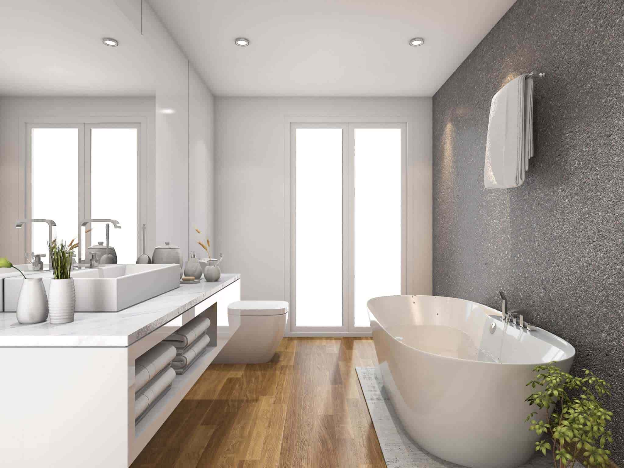 A bathroom featuring white fixtures, grey accent wall and timber-look flooring