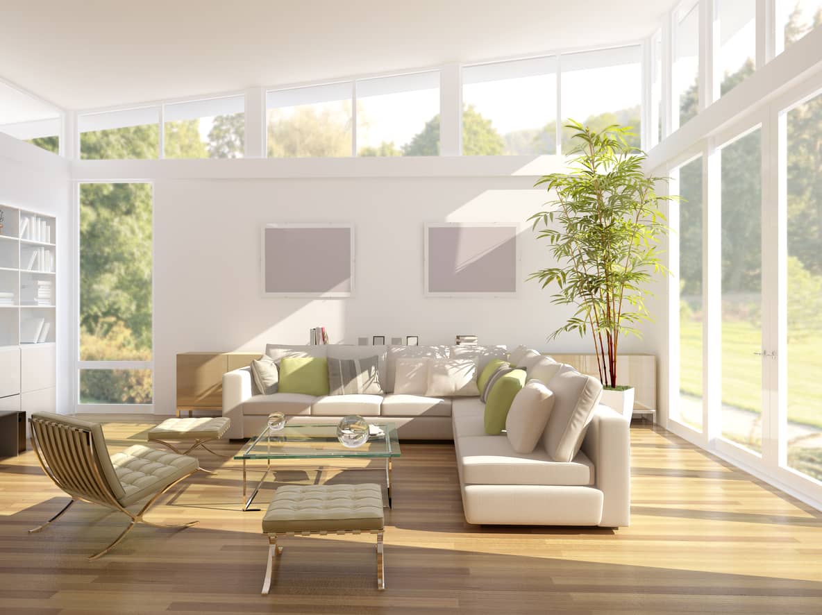 Bright family living room with bamboo flooring and large windows