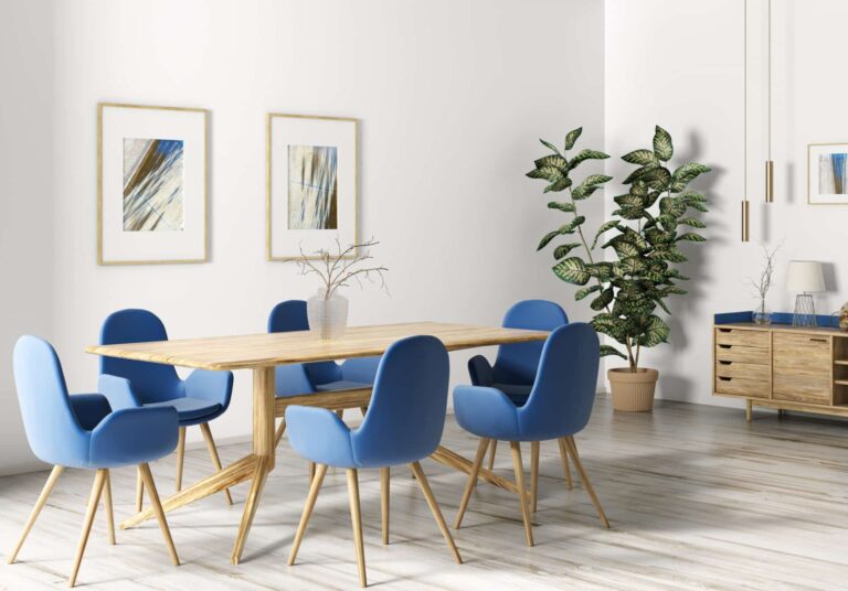 Dining room featuring wooden table, blue chairs and timber-look flooring