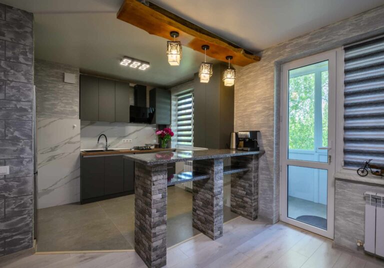 Kitchen interior with laminate panels installed on the wall.