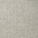 Close-up view of beige carpet texture showing dense looped pile construction with neutral cream and gray tones in a repeating pattern