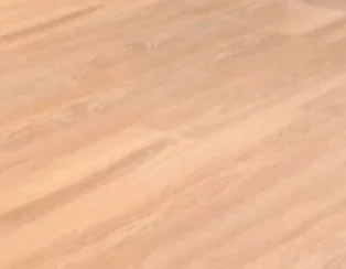 Close-up texture of a light oak or maple commercial hard flooring swatch showing natural wood grain patterns and diagonal directional lines characteristic of quality engineered hardwood.