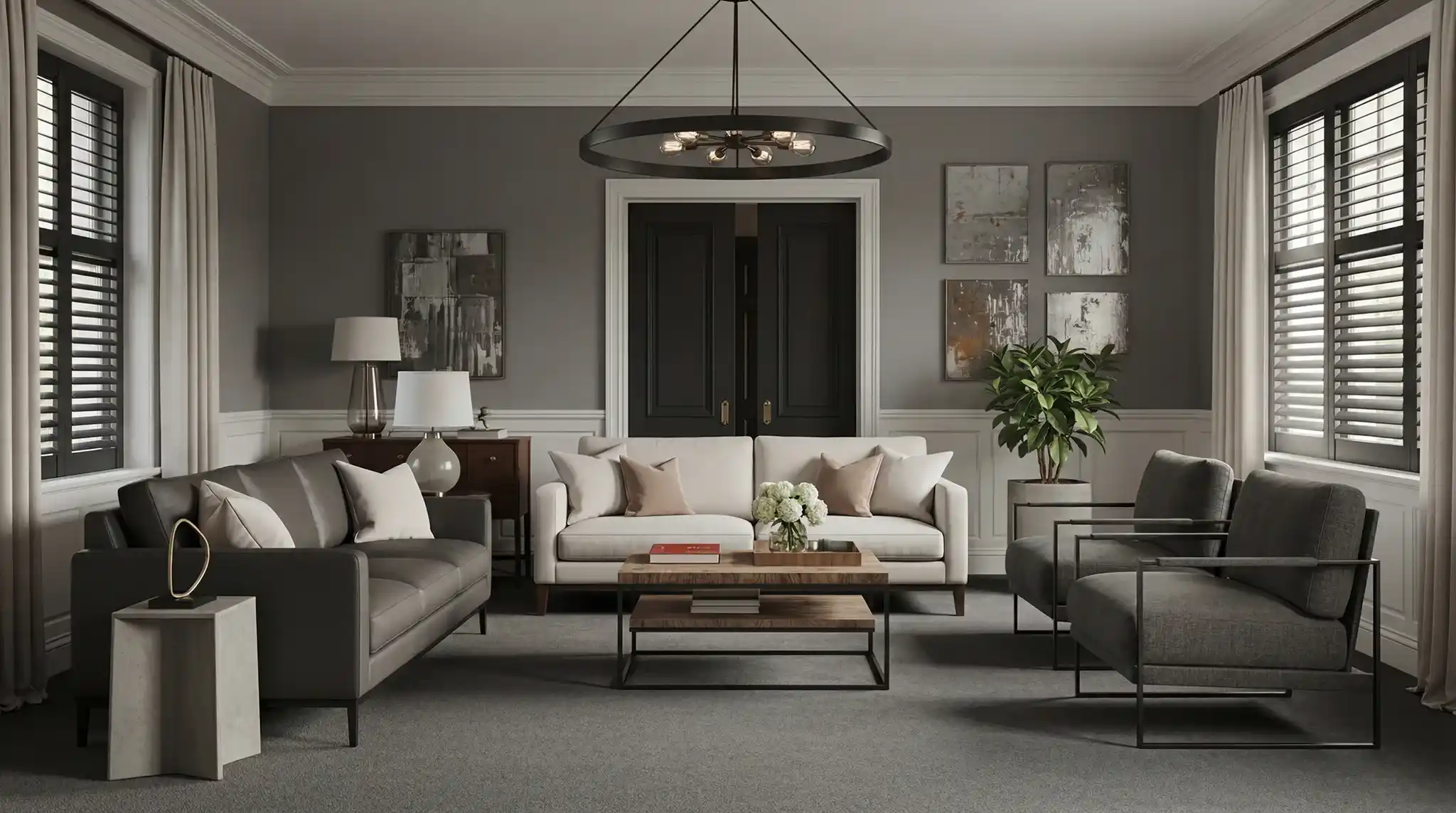Elegant modern living room featuring grey walls, light grey carpet, white and charcoal sofas, dark wood coffee table, abstract wall art, and black window shutters